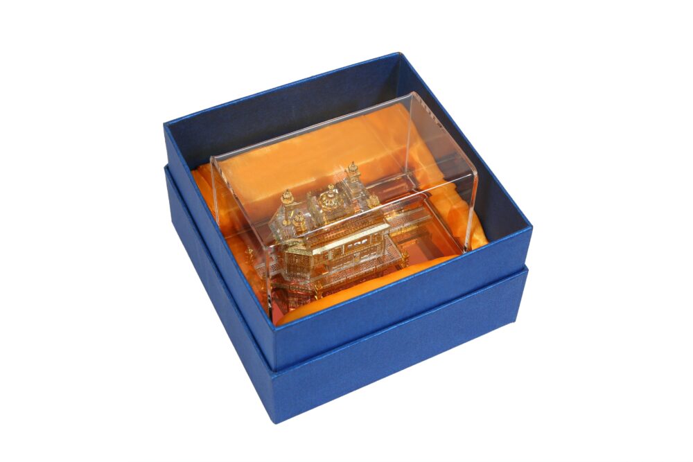 24K gold-plated Golden Temple idol from The Sikh Essentials, shown in its box.